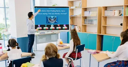 Teacher conducting an interactive quiz game with young students in a classroom, displayed on a digital screen.